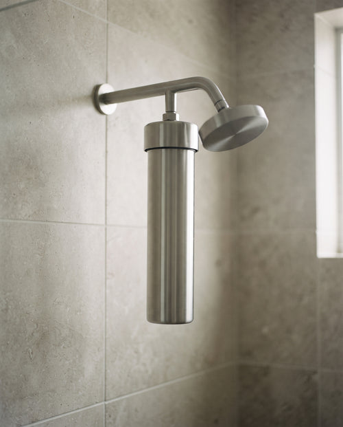 VATNARA filter mounted between shower arm and showerhead