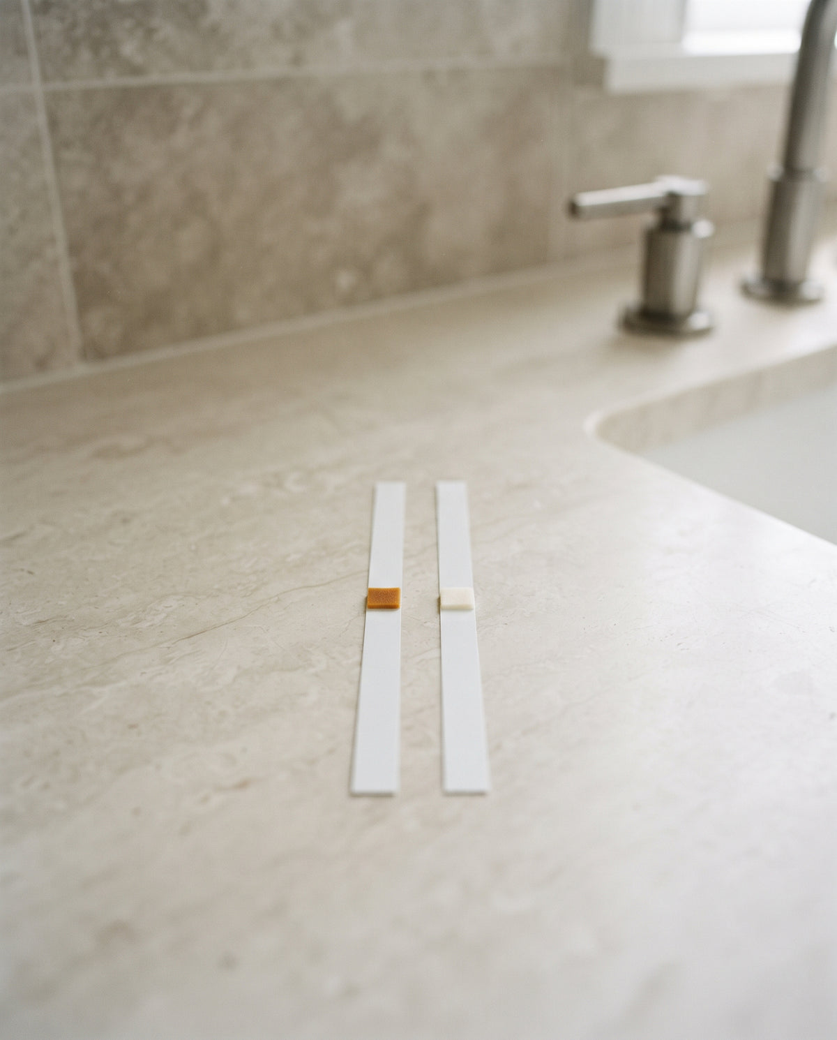 Two chlorine test strips: before and after filtering
